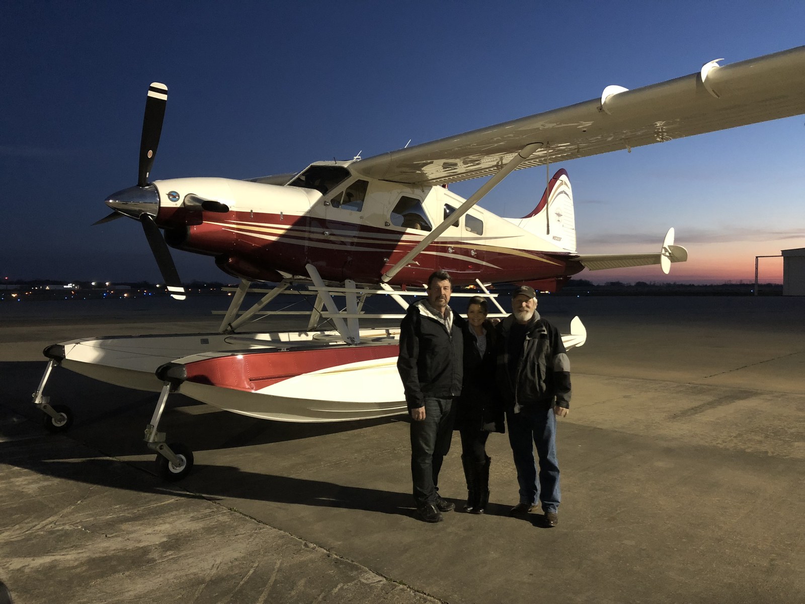 Craig Hosking and crew beside amphibious turbine floatplane at dusk