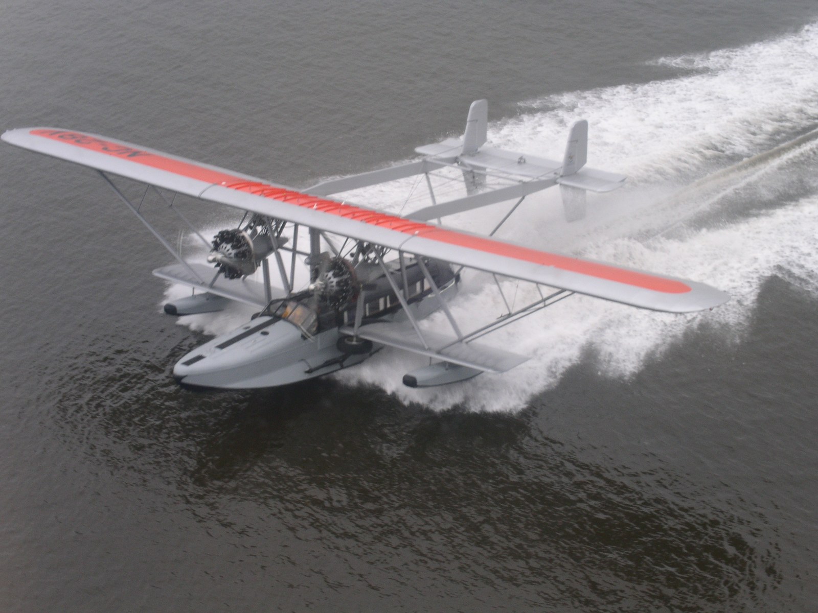 Vintage Sikorsky S-38 amphibious flying boat skimming across the water
